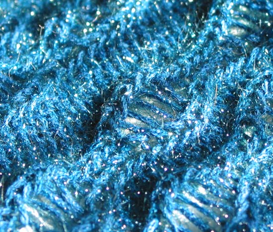 The yarn sparkles like Christmas lights.